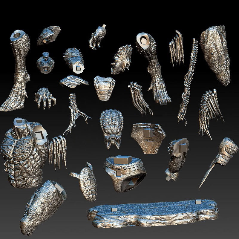 Collection of metallic fantasy creature parts on a dark background