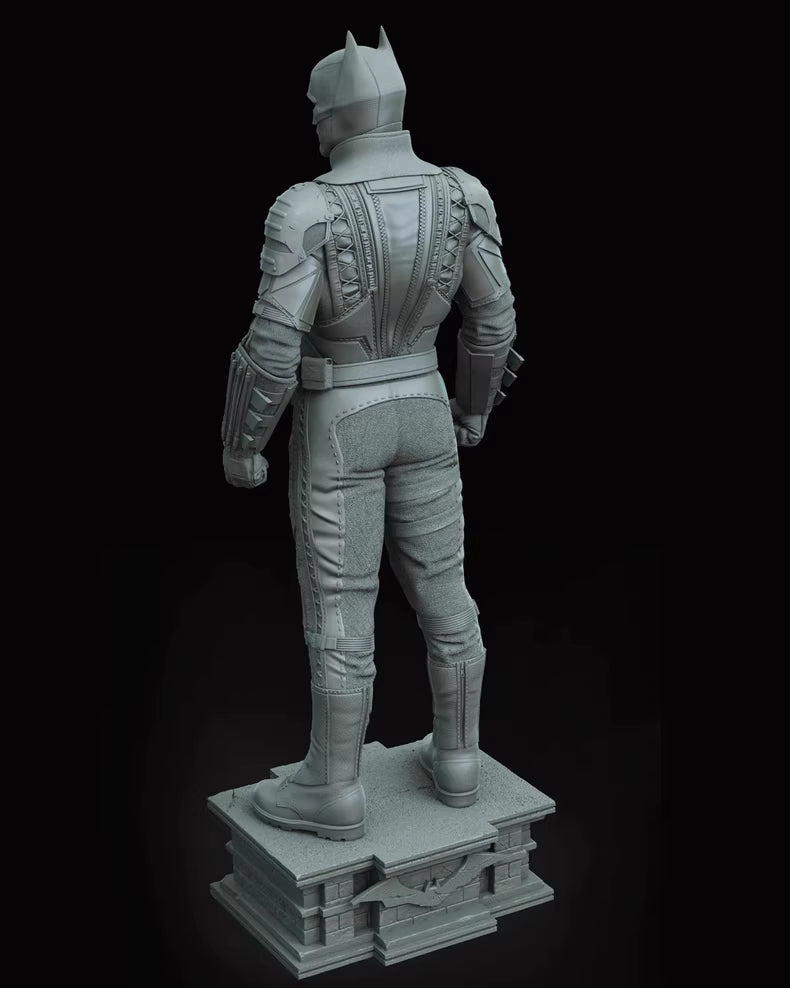 Gray superhero statue on a black background