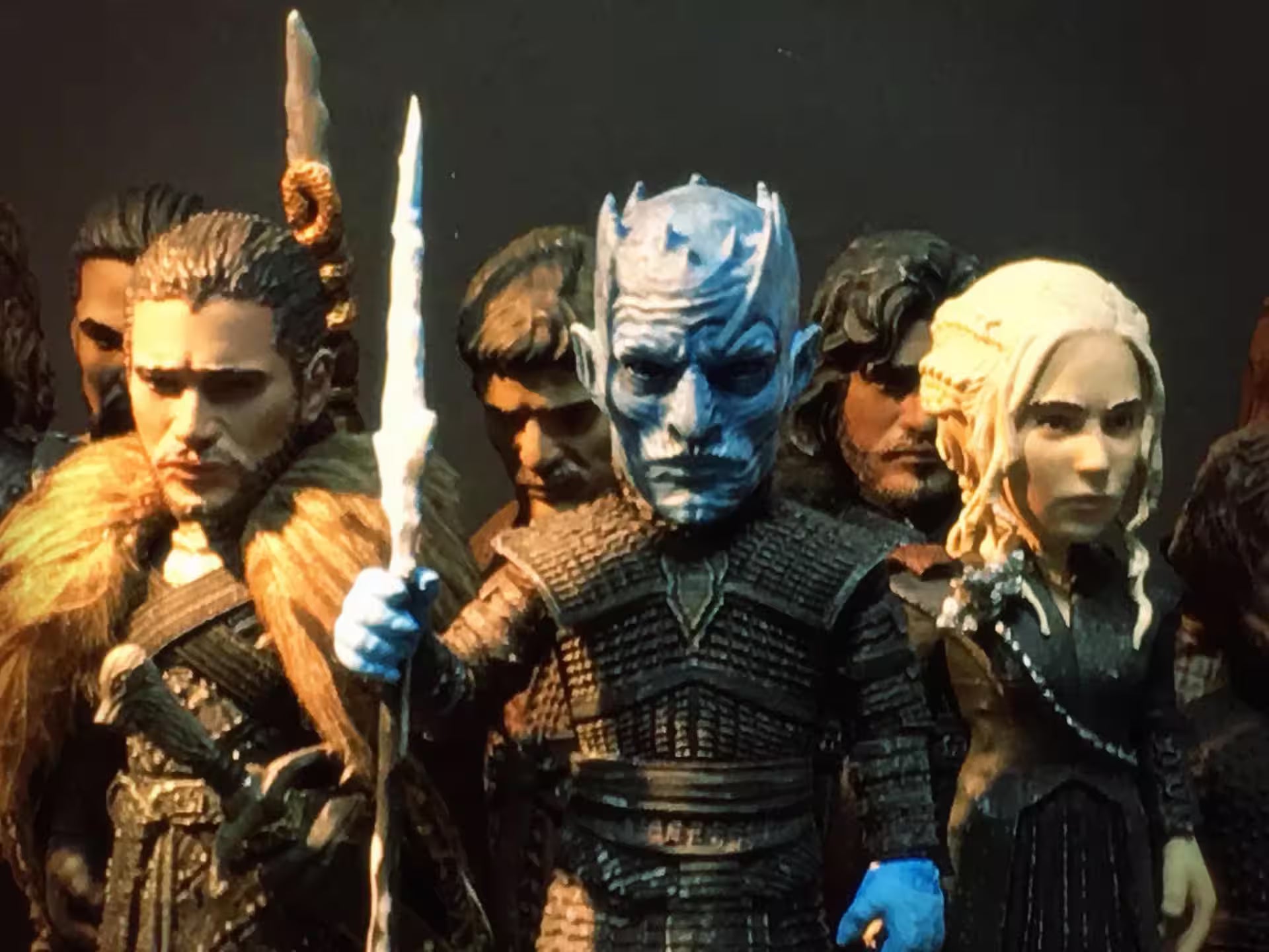 Collection of action figures from a fantasy series with detailed costumes and props.