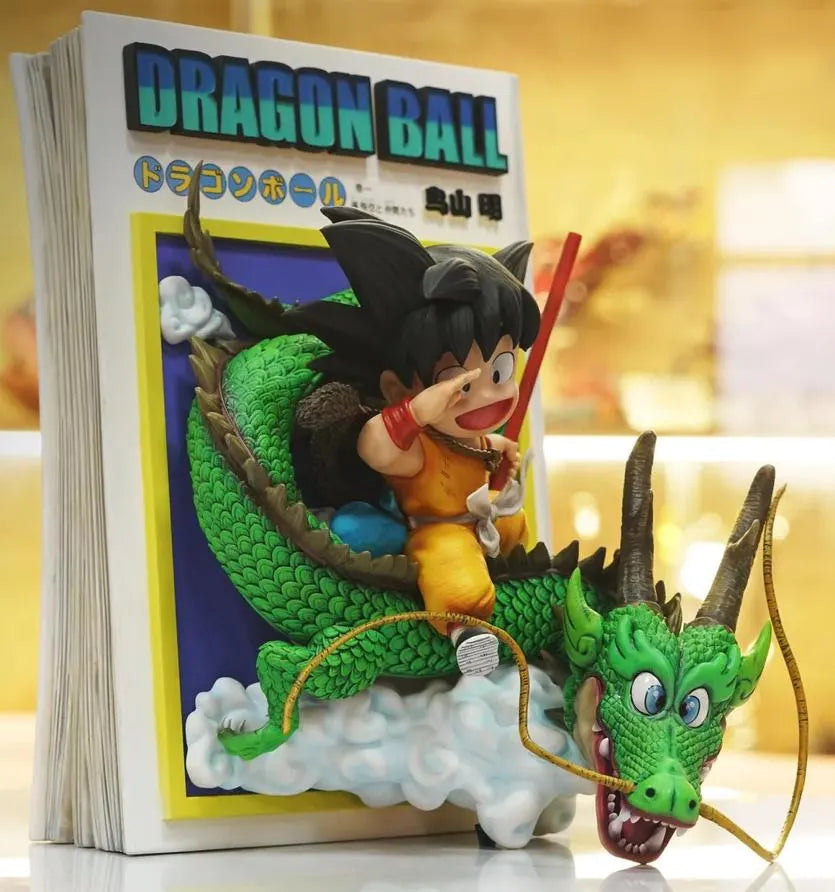 Dragon Ball-themed figurine of a character riding a dragon in front of a book