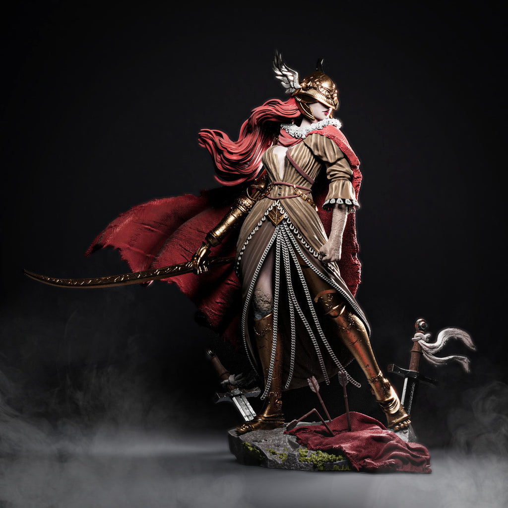 Statue of a warrior with a red cape and armor, holding a sword, on a dark background.