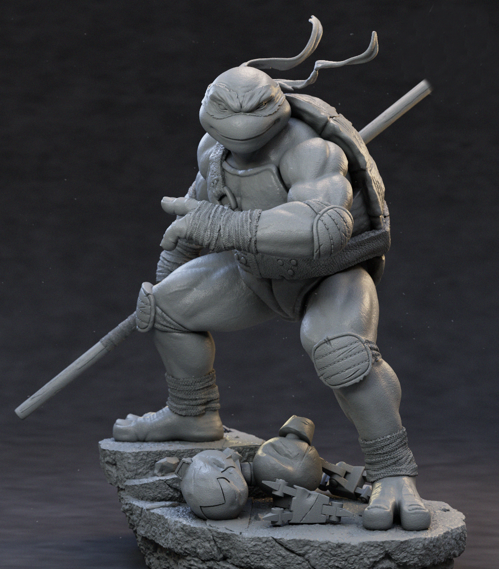 A monochrome gray 3D-printed或未上漆 collectible statue of a Teenage Mutant Ninja Turtle in a crouching pose, holding a sai, standing on a rocky base with two helmets at its feet, photographed against a dark studio background.