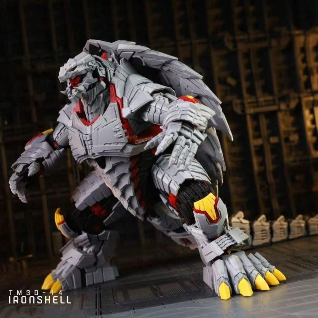 A gray robotic monster figure with red and yellow accents, posed in a dynamic stance against a dark industrial background. The figure has a textured, blocky sci-fi design with clawed feet and glowing red eyes.