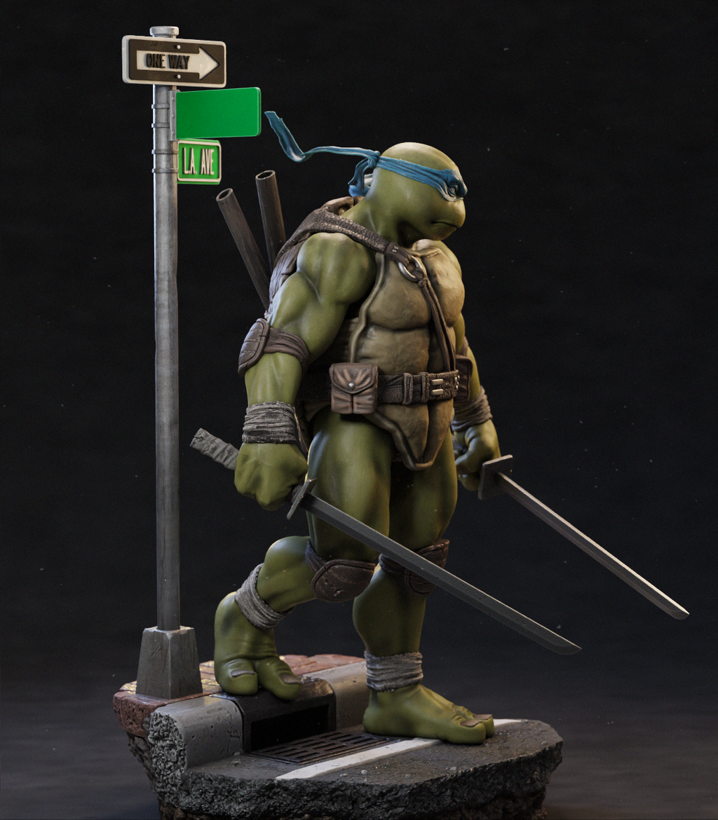 A detailed collectible statue of a Teenage Mutant Ninja Turtle standing on a street-sign base against a dark studio background. The turtle wears a blue headband and holds two swords, with a backpack and additional accessories visible.