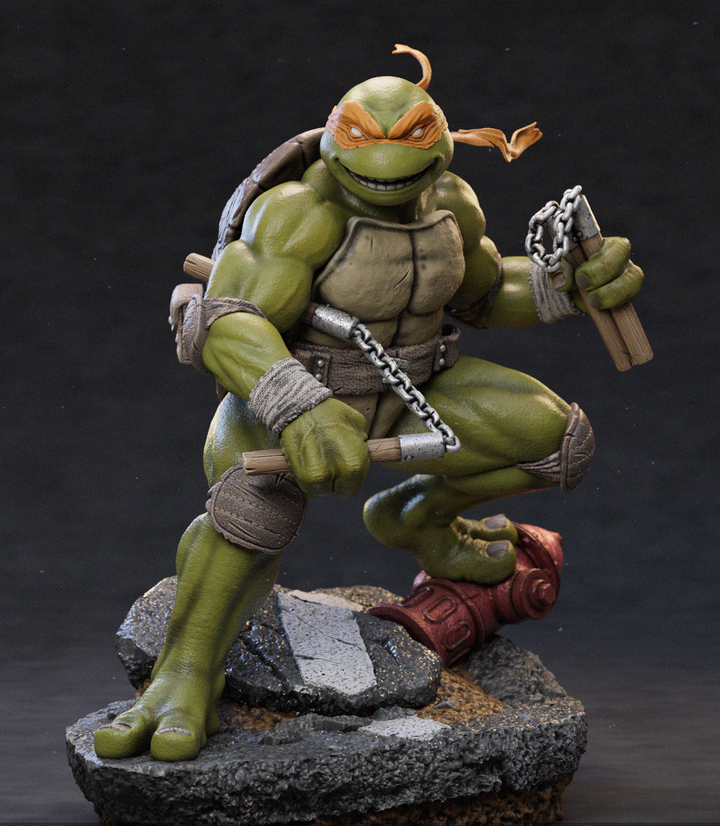 A detailed collectible figurine of Michelangelo from Teenage Mutant Ninja Turtles, posed dynamically on a rocky base against a dark studio background. The figure features his signature green skin, orange mask, brown shell, and gray pants, holding nunchucks in one hand and a chain in the other.