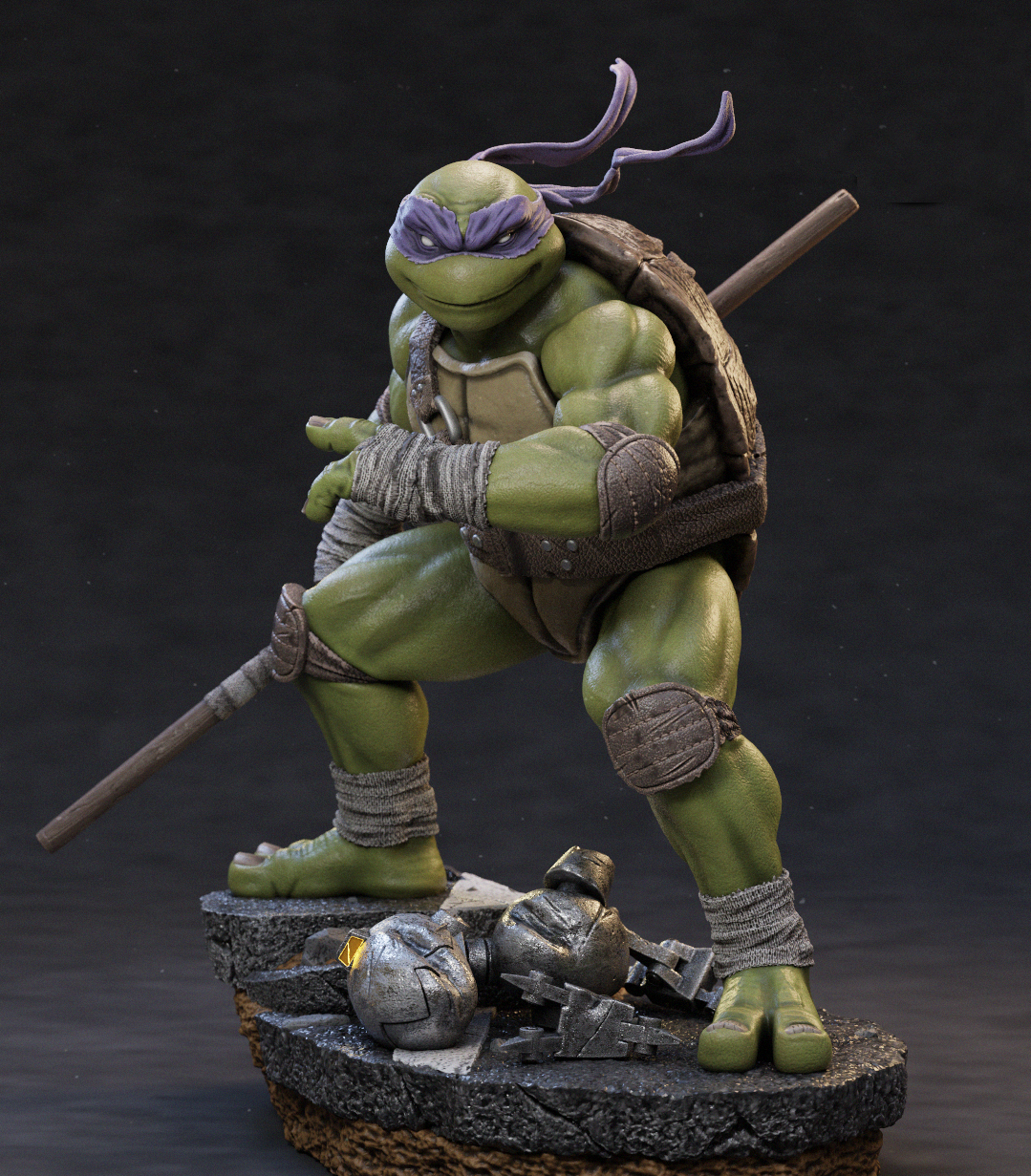 A detailed collectible figurine of a green turtle character in a crouched combat pose, holding a staff, standing on a rocky base with debris. The figure has purple eye masks, a brown shell, and weathered armor details, photographed against a dark studio background.