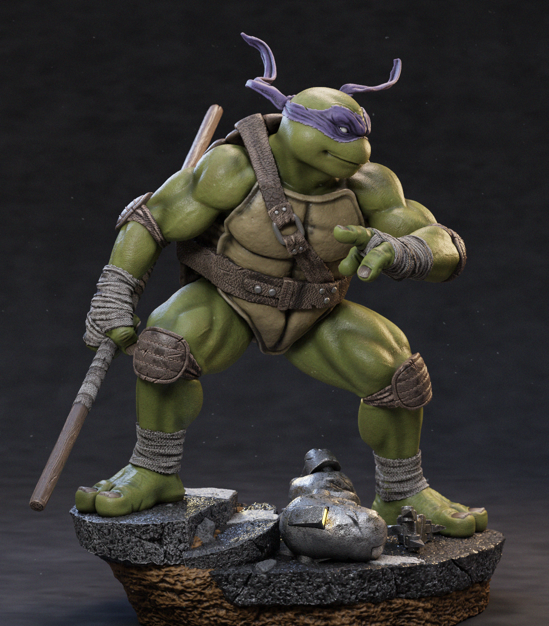 A detailed collectible statue of a green turtle character in a crouching combat pose, wearing a purple mask and holding a wooden staff, mounted on a rocky base against a dark studio background.