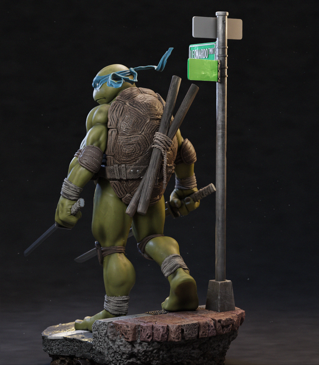 A detailed collectible statue of a Teenage Mutant Ninja Turtle standing on a rocky base next to a street sign, photographed against a dark studio background.