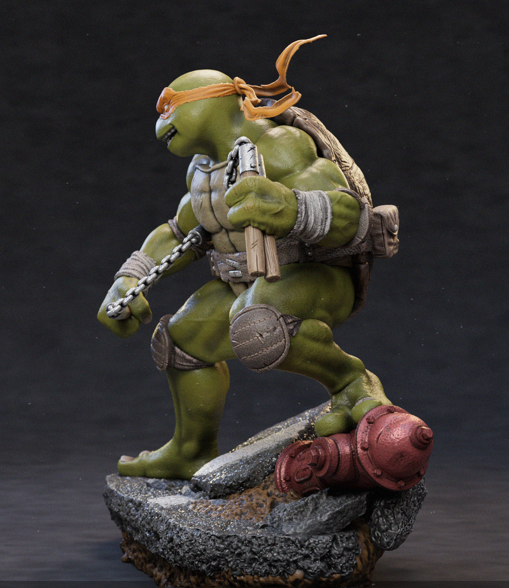 A detailed collectible statue of a green turtle character in a dynamic crouching pose, wearing an orange bandana and carrying a backpack, standing on a rocky base with a red cylindrical prop against a dark studio background.