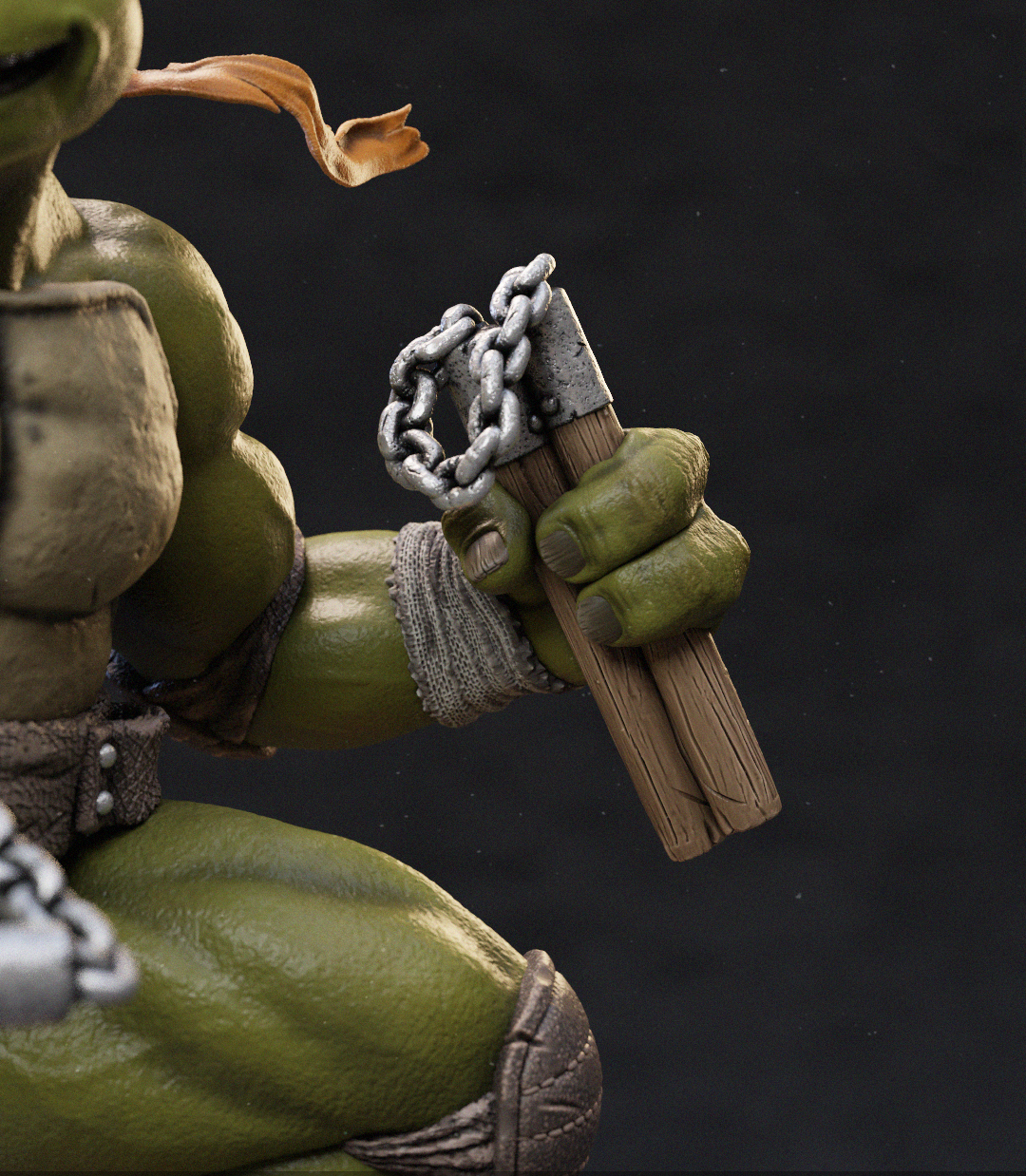 Close-up of a green-skinned action figure or collectible character holding a pair of wooden nunchucks with a metal chain, against a dark studio background.