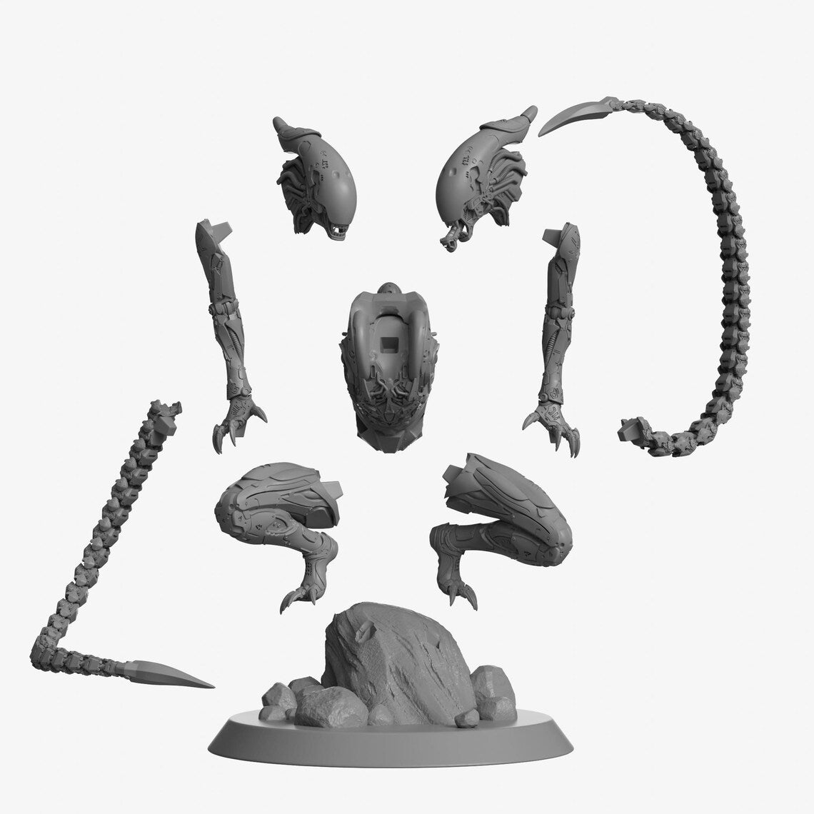 Gray miniature figurine parts on a white background