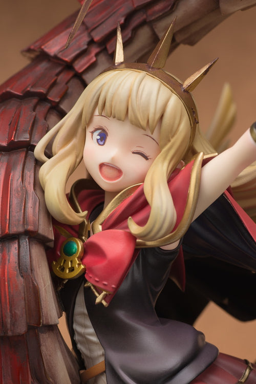 Figurine of a character with blonde hair and red outfit against a wooden background