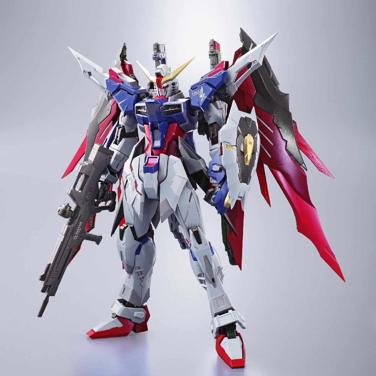 Detailed robot model with red, blue, and gray colors on a light gray background