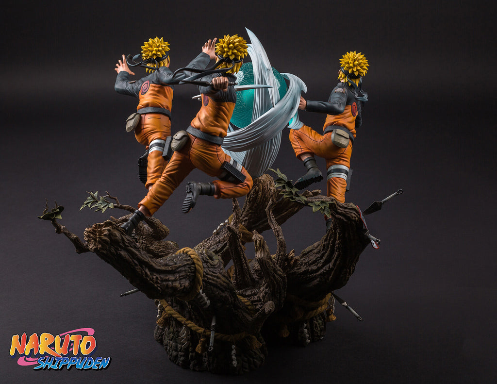 Statue of a character from 'Naruto' with multiple poses on a dark background