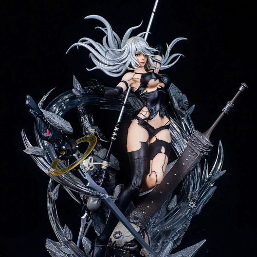 Statue of a fantasy character with long white hair and black outfit on a dark background