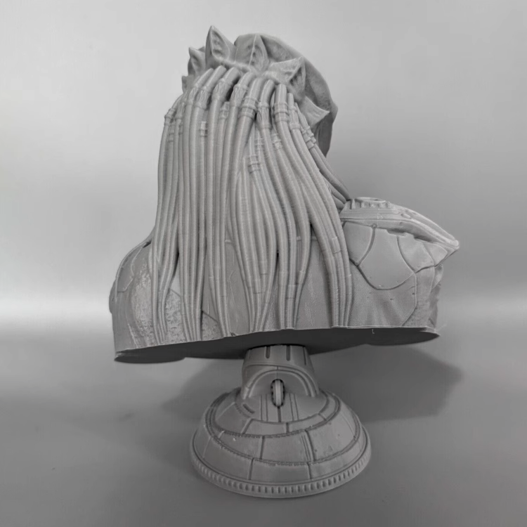 Gray textured predator bust on a stand against a gray background