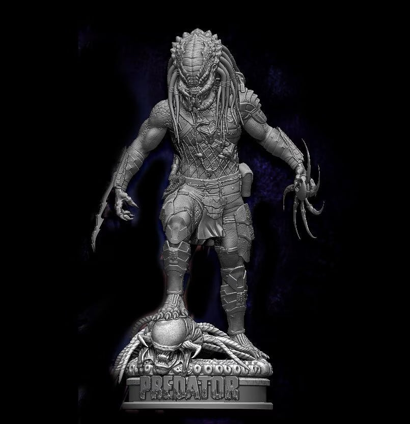Predator figurine with detailed armor and emblem on a dark background