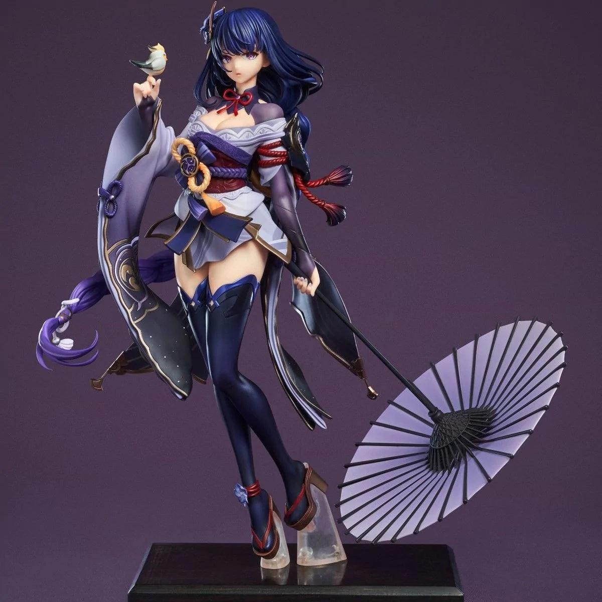 Detailed figurine of a character with blue hair and traditional attire on a purple background
