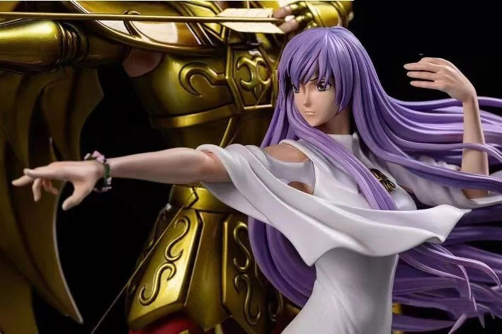 Figurine with gold armor and purple hair in a dynamic pose