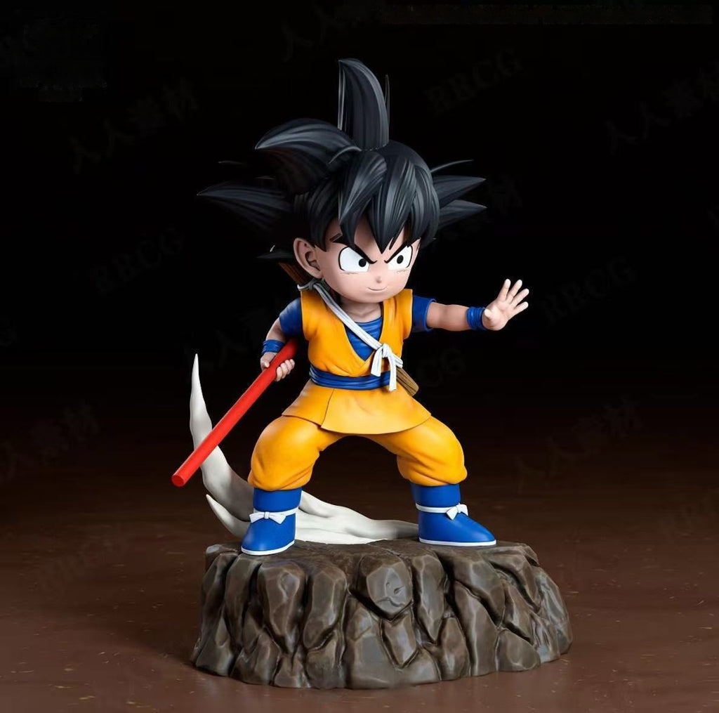 Action figure of a character in an orange and blue outfit with a red weapon on a dark background