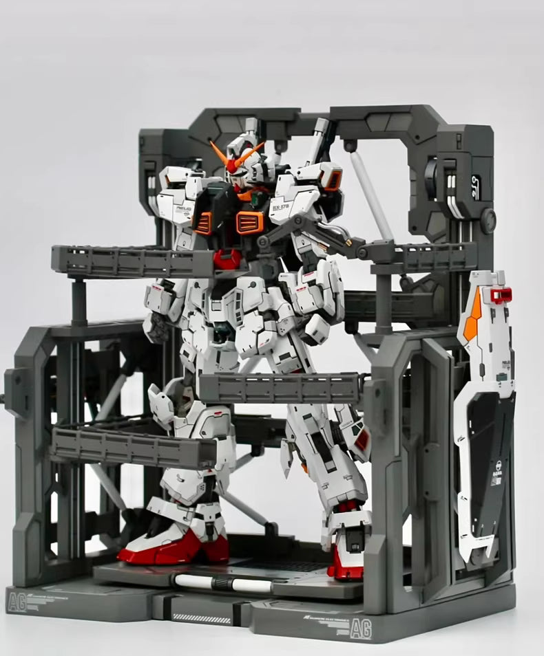 Model kit of a robot in a partially assembled state on a gray background