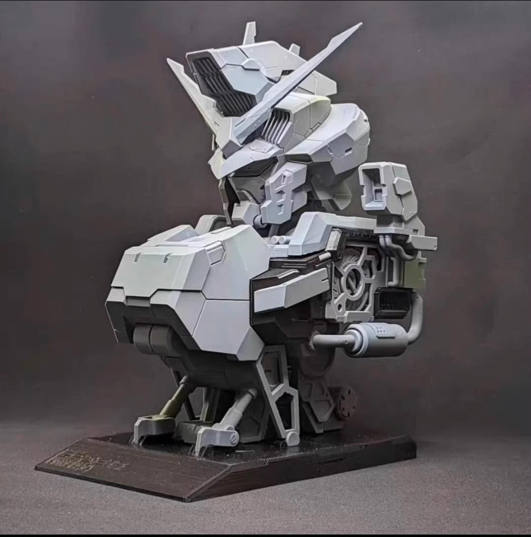 Mechanical model on a stand against a dark background