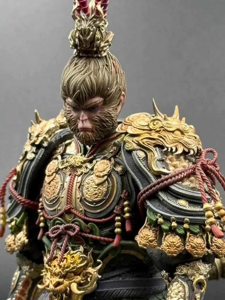 Detailed figurine of a warrior with ornate armor and headpiece on a gray background