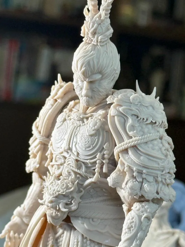 Detailed figurine with intricate designs on a blurred background