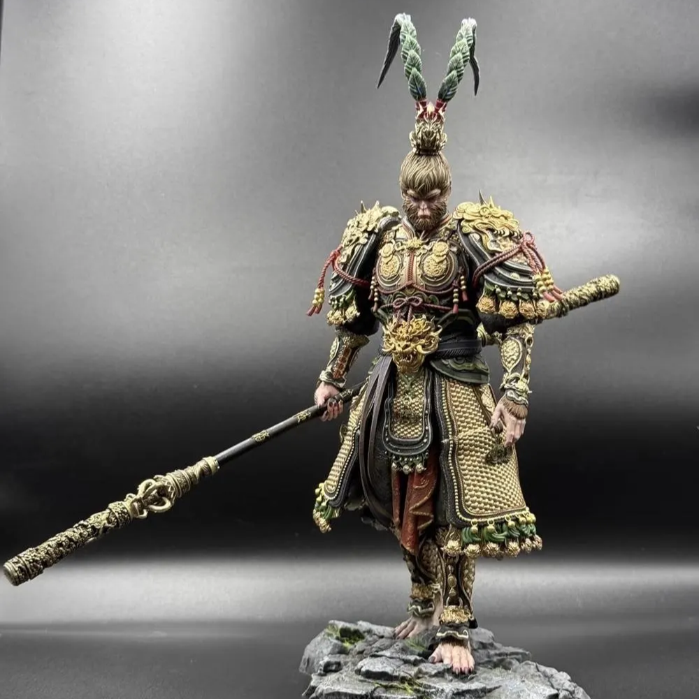 Figurine of a warrior in ornate armor with a spear on a gray background