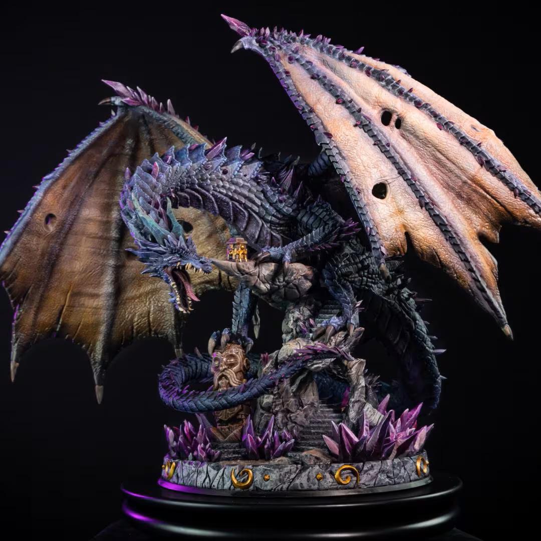 A highly detailed fantasy dragon figurine with spread wings, standing on a rocky base with purple crystals and a small creature, photographed against a black background.