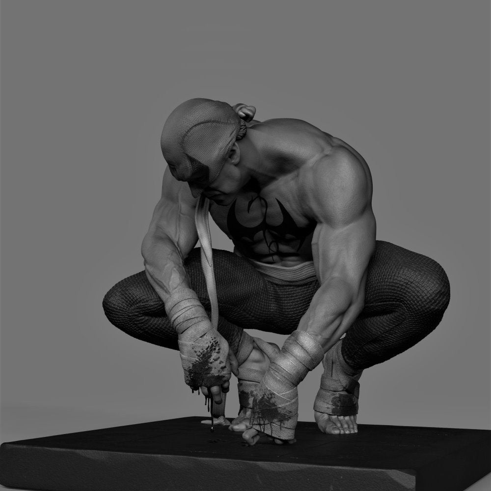 Muscular figure in a crouching position with a gray background