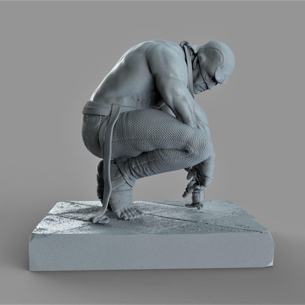 Gray sculpture of a person on a gray background