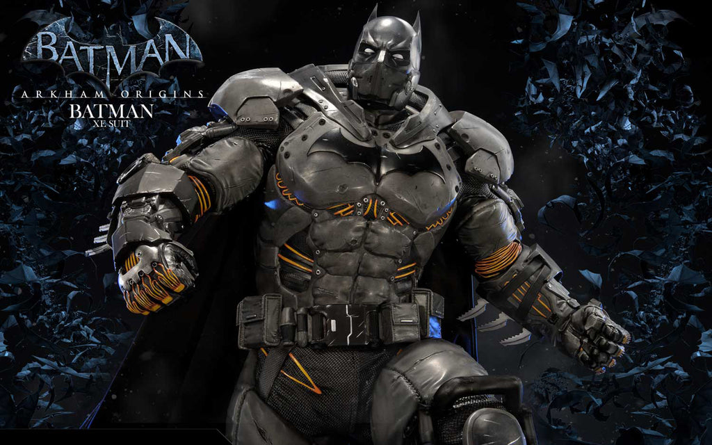 A highly detailed Batman collectible figure in armored suit, posed dynamically against a dark, smoky background with the Batman logo and 'Arkham Origins Batman Annual 2023' text visible in the upper left.