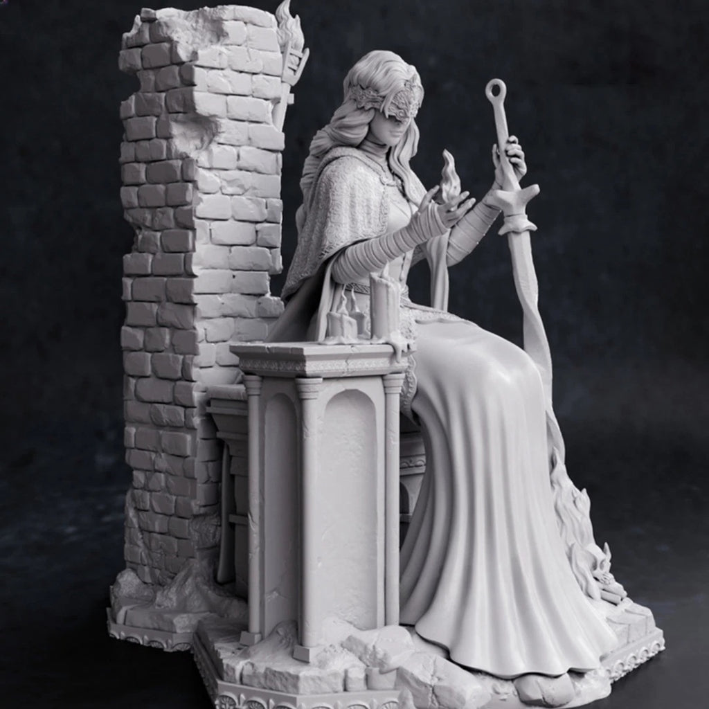 Statue of a figure in a robe holding a staff against a dark background