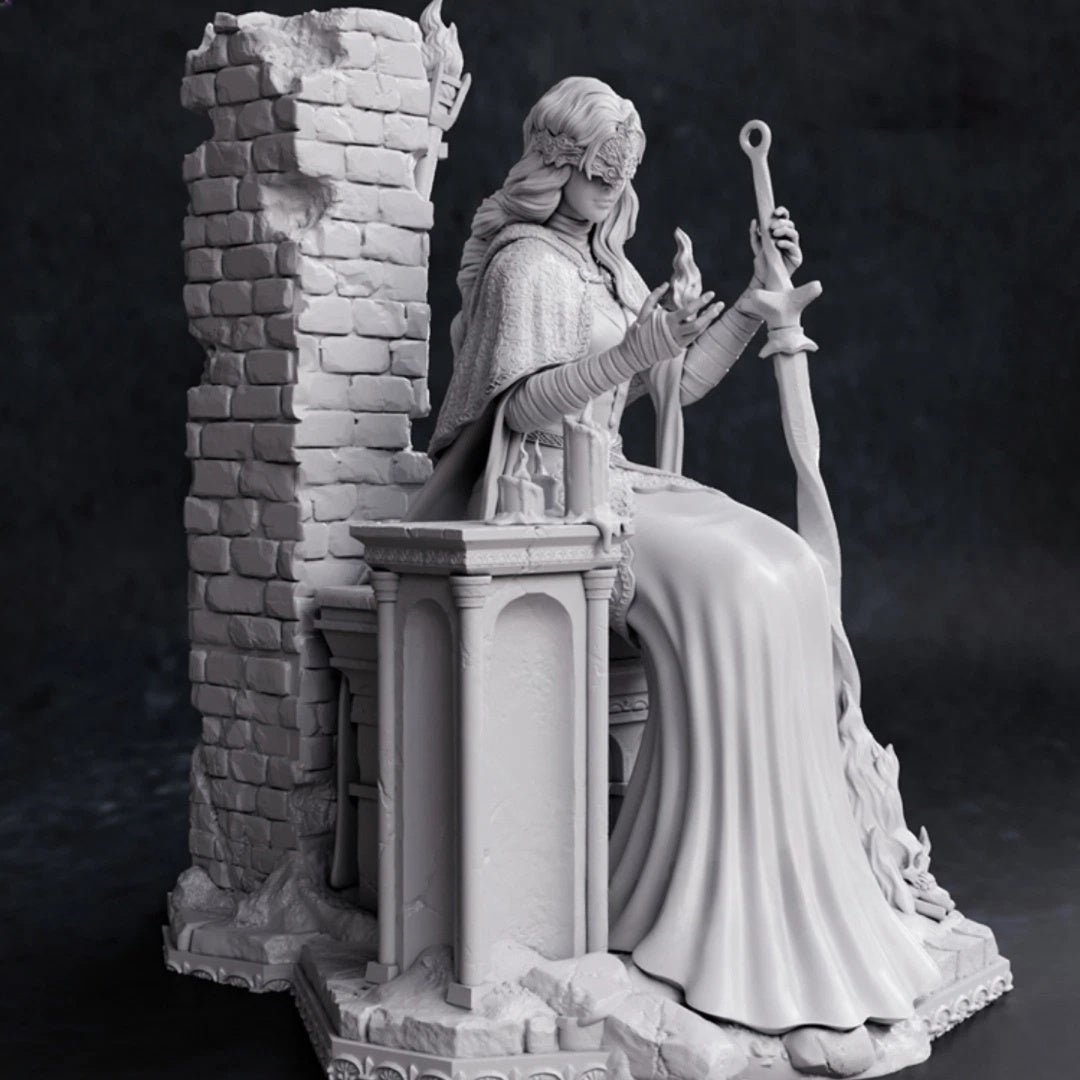 Statue of a figure in a robe holding a staff against a dark background